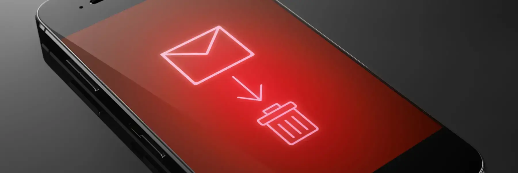 Auf einem Handy sieht man eine Datei, die in eine Mülltonne wandert