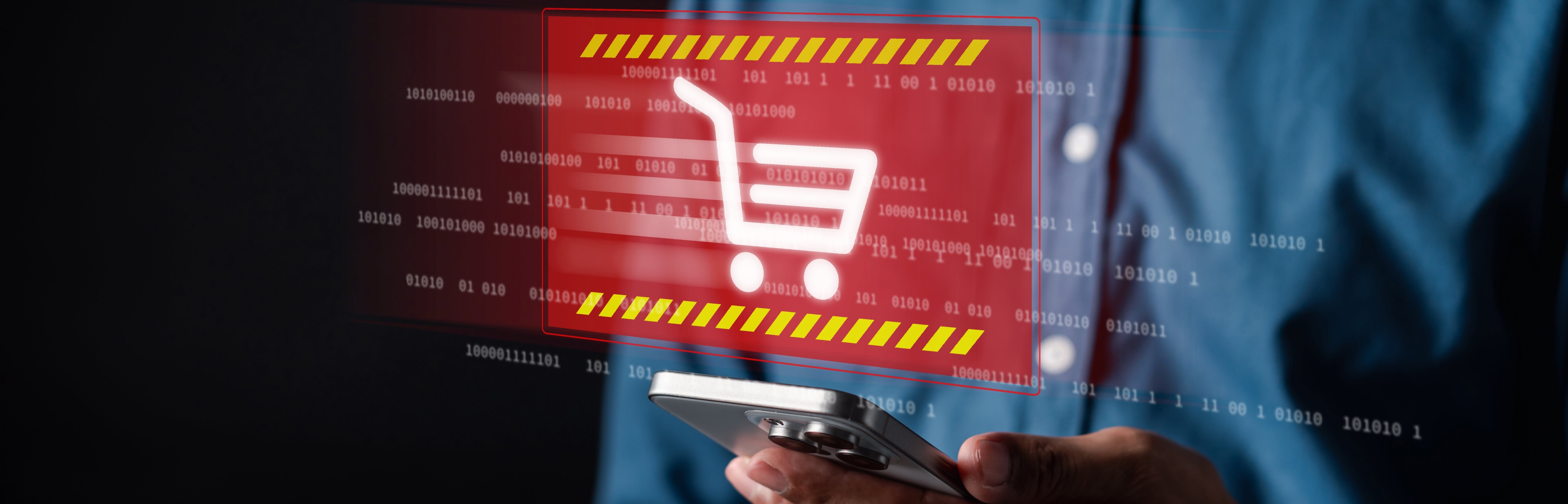 Über einem Smartphone erscheint eine Warnung zu einem Fake-Shop